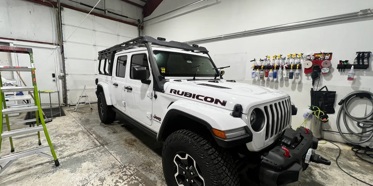White Jeep Wrangler Rubicon in the Ascent Auto Detailing shop — Silverthorne CO